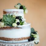 white and brown cake with green leaf on top